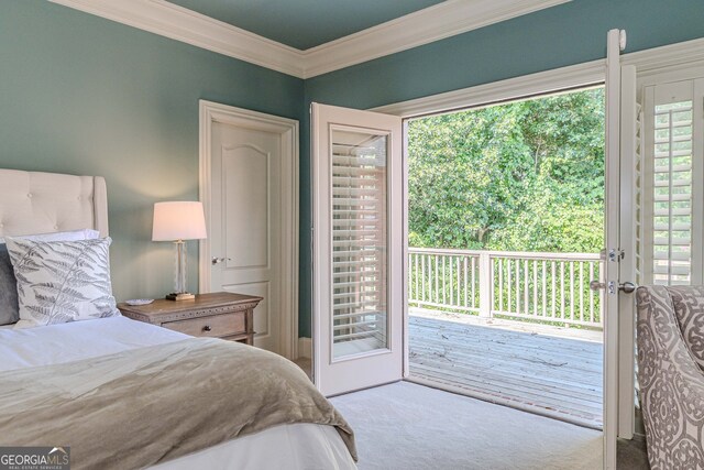 carpeted bedroom with access to exterior and ornamental molding