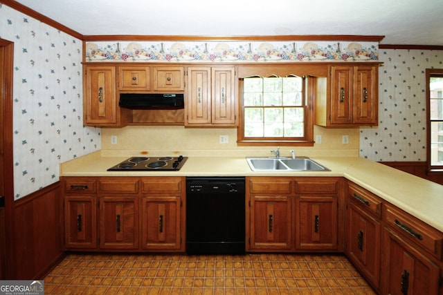 kitchen featuring black appliances, a sink, and wallpapered walls