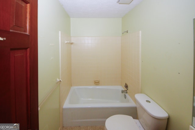 full bathroom featuring shower / tub combination, a textured ceiling, and toilet