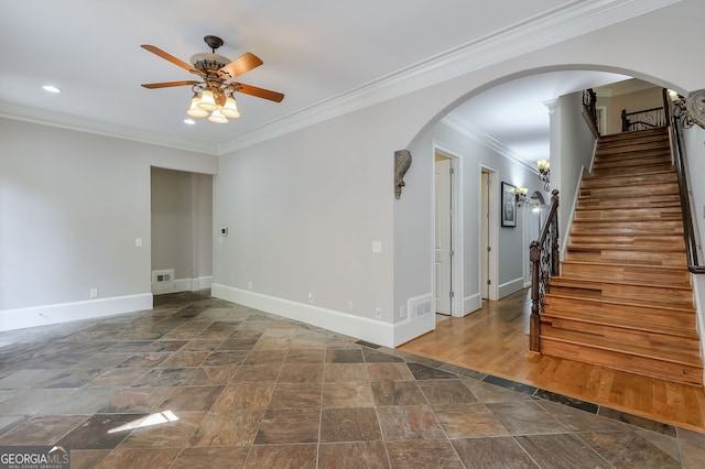 interior space featuring ceiling fan, hardwood / wood-style floors, and ornamental molding