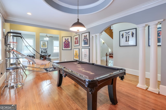 rec room with crown molding, pool table, light wood-type flooring, ornate columns, and ceiling fan