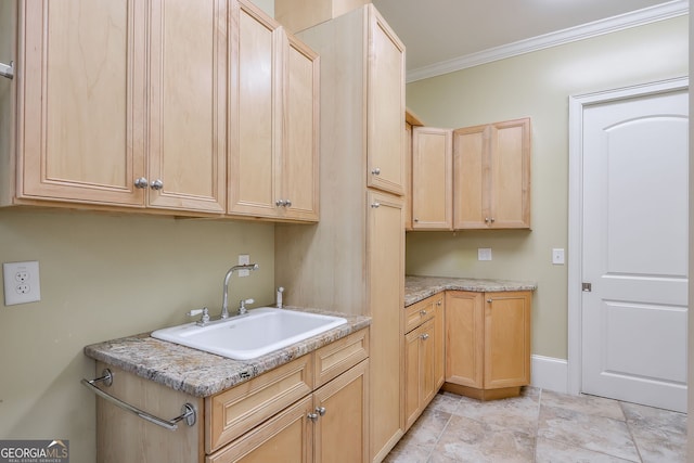 washroom with light tile patterned floors, sink, and crown molding