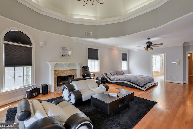 living room with light hardwood / wood-style flooring and a healthy amount of sunlight