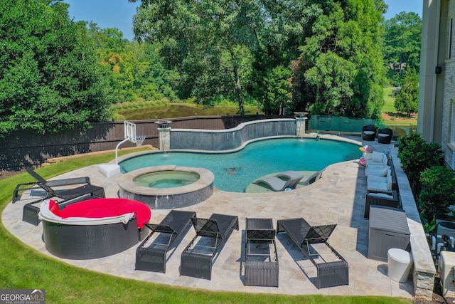 view of swimming pool featuring an in ground hot tub, a patio, pool water feature, and an outdoor hangout area