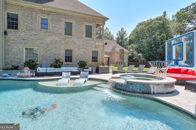 view of pool featuring an in ground hot tub, a patio, and outdoor lounge area