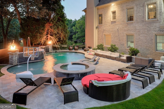 view of swimming pool featuring an in ground hot tub, a patio area, and pool water feature