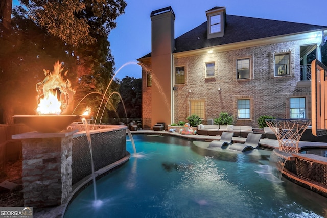 view of pool with pool water feature