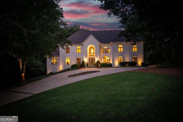 view of front of home with a yard