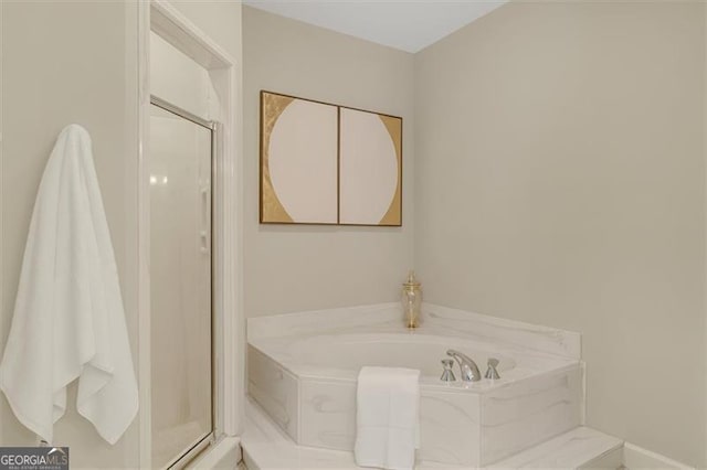 bathroom with separate shower and tub