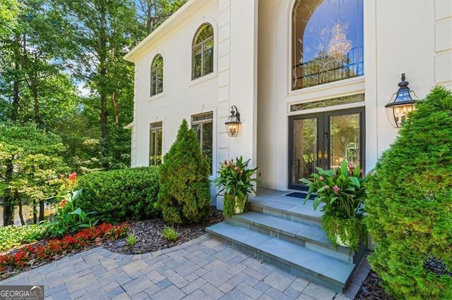 view of exterior entry featuring french doors