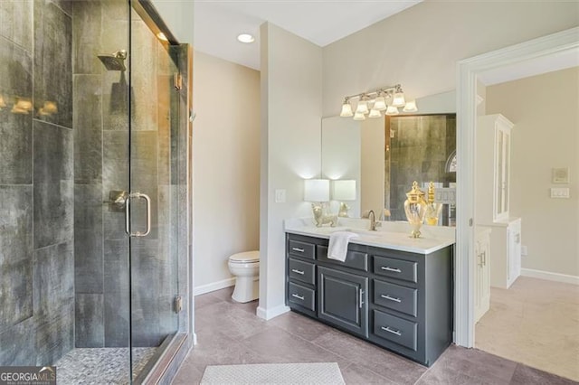 bathroom with an enclosed shower, vanity, and toilet