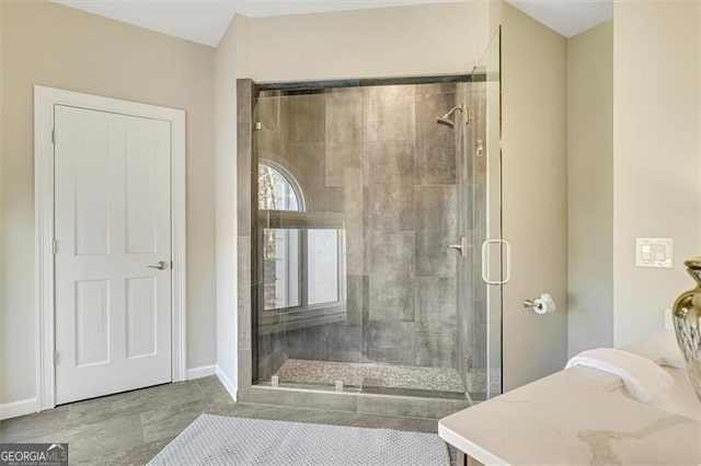 bathroom featuring a shower with door