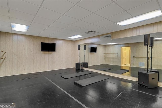 workout room with wood walls