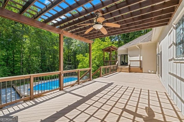 view of patio with a pergola, ceiling fan, and a pool side deck