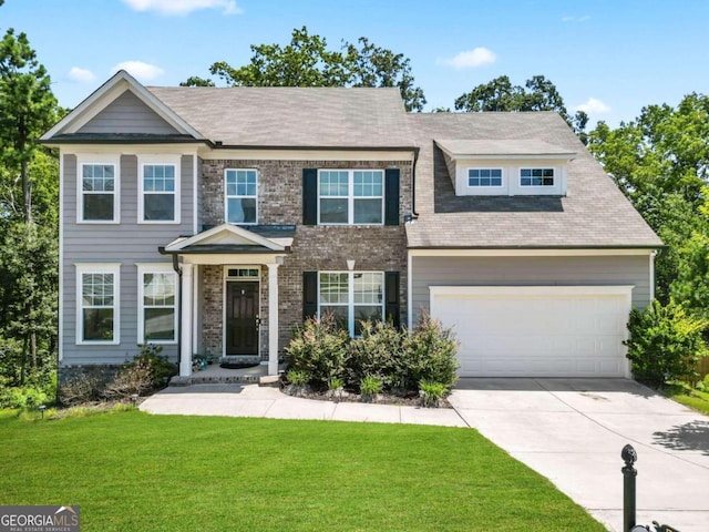 view of front facade featuring driveway, a front lawn, an attached garage, and brick siding