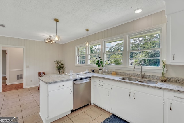 kitchen featuring light tile patterned floors, sink, stainless steel dishwasher, and kitchen peninsula