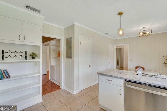 kitchen with white cabinets, dishwasher, ornamental molding, and light tile patterned flooring