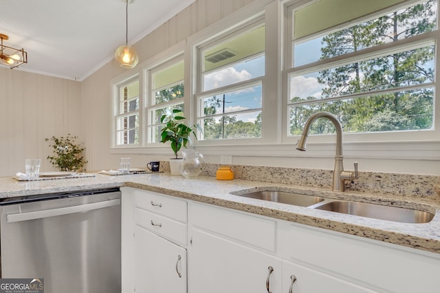 kitchen featuring pendant lighting, sink, ornamental molding, white cabinetry, and stainless steel dishwasher