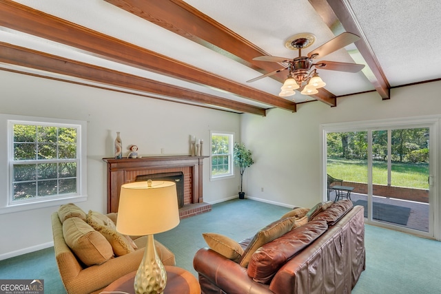 living room featuring beam ceiling, a textured ceiling, a brick fireplace, and carpet flooring