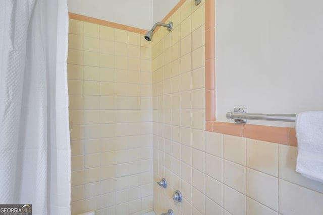 bathroom with shower / bath combination with curtain