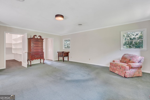 sitting room with carpet flooring and ornamental molding