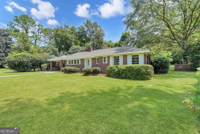 ranch-style house with a front lawn