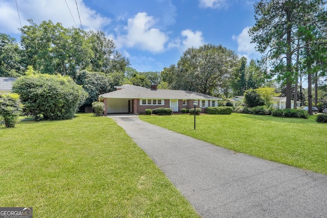 ranch-style home with a front lawn