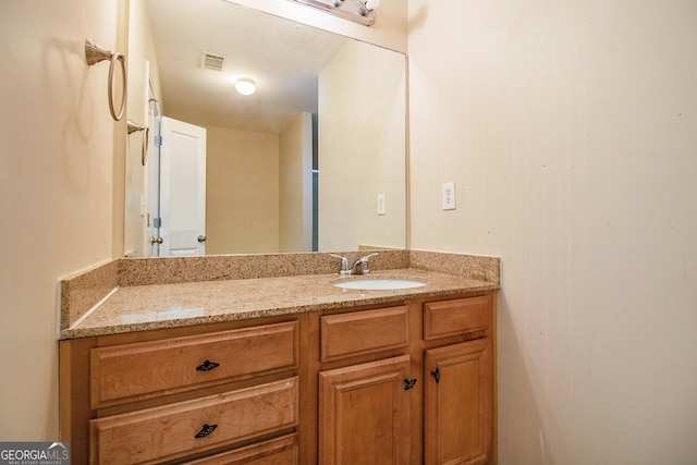 bathroom with visible vents and vanity