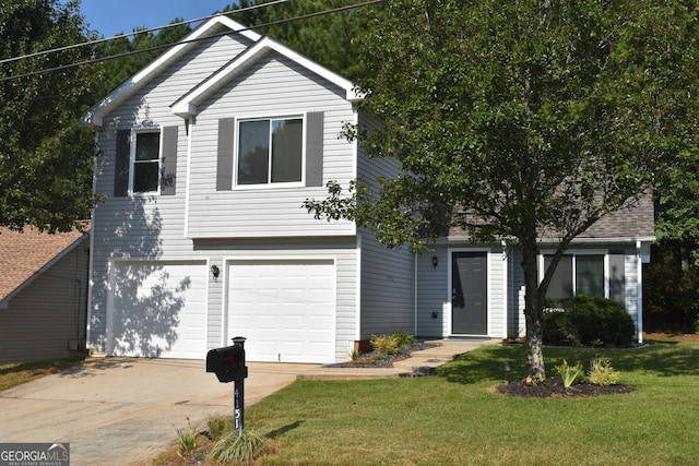 view of front of house with a garage and a front lawn