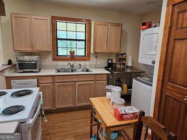 kitchen featuring dark wood-type flooring, sink, and electric stove