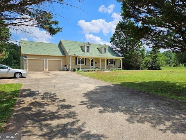 view of front of house featuring a garage, a front lawn, a porch, and central air condition unit