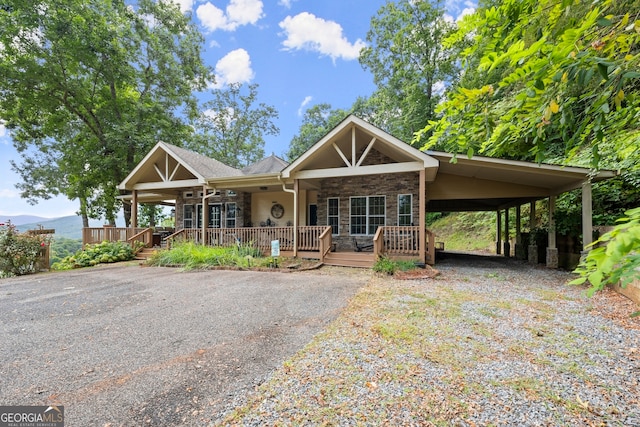 view of front of house featuring a carport and covered porch