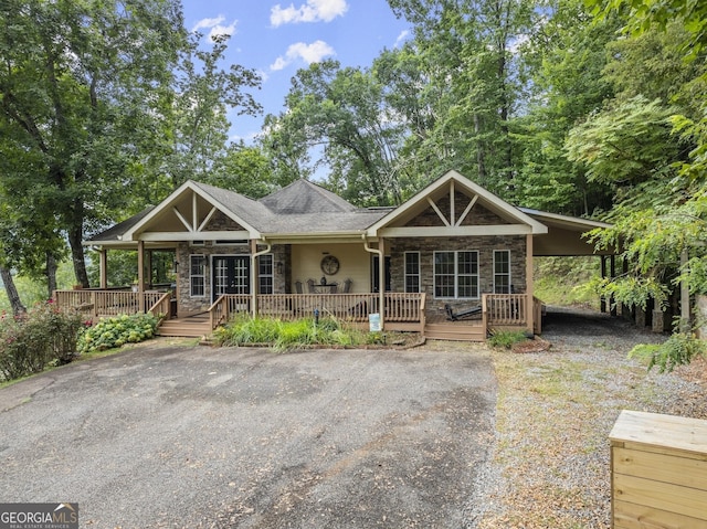 view of front facade with a carport and a porch