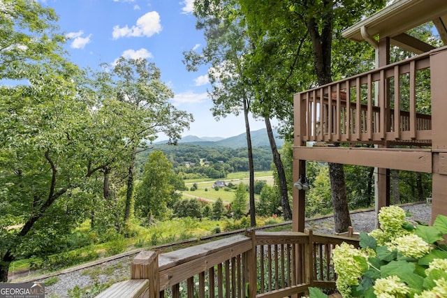 wooden deck featuring a mountain view