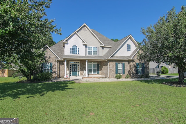 craftsman-style house with a porch and a front yard