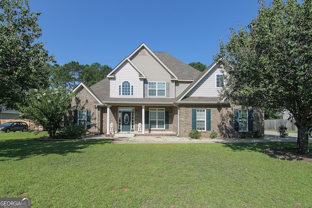 craftsman house featuring a front yard and a porch