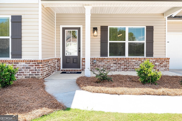 property entrance featuring covered porch