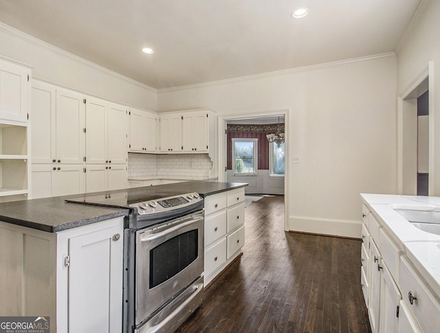 kitchen with white cabinets, ornamental molding, electric range, and dark wood-type flooring