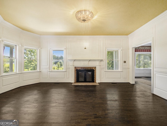 unfurnished living room featuring dark hardwood / wood-style flooring and a fireplace