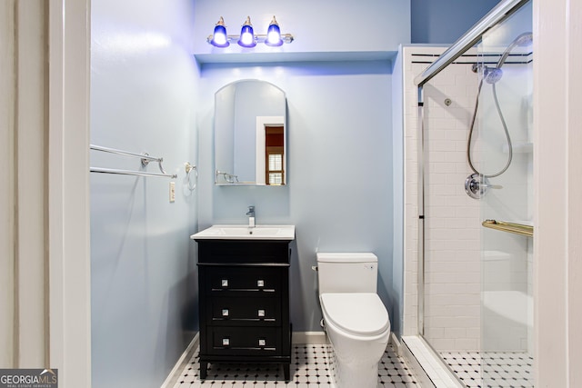 bathroom with a shower with shower door, toilet, vanity, and tile patterned flooring