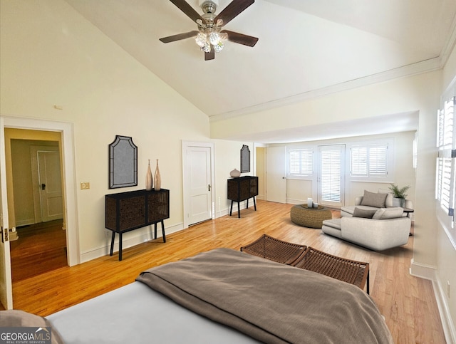 living room with ceiling fan, wood-type flooring, and high vaulted ceiling