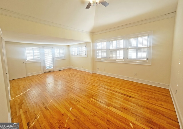 unfurnished room featuring ceiling fan, light hardwood / wood-style flooring, crown molding, and vaulted ceiling