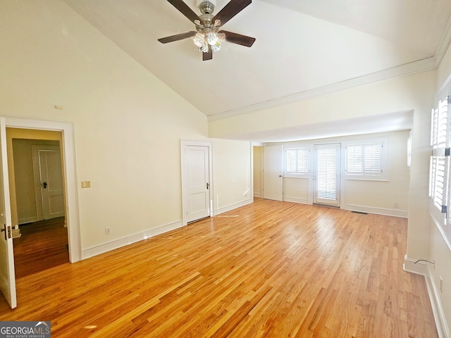 unfurnished living room with ceiling fan, high vaulted ceiling, and light wood-type flooring