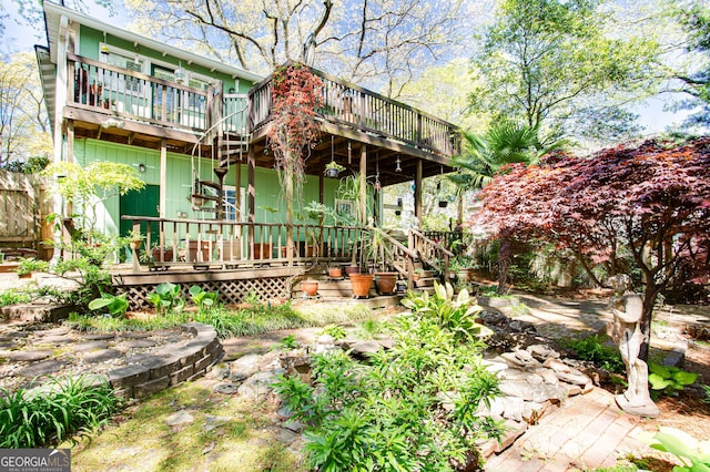 rear view of property with a wooden deck