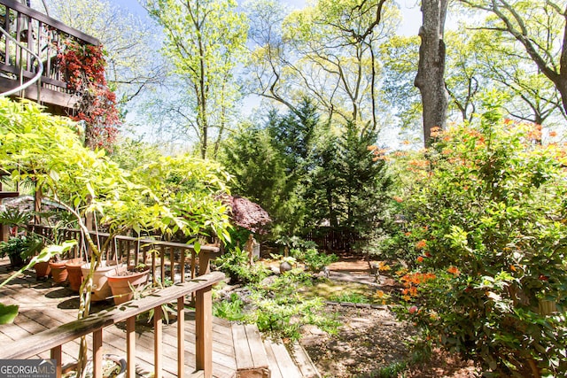 view of yard with a wooden deck