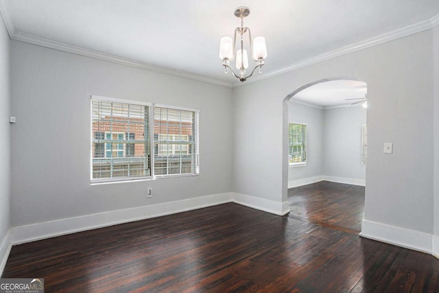 unfurnished room featuring a notable chandelier, crown molding, and hardwood / wood-style floors