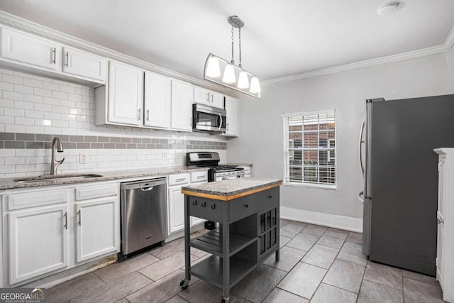 kitchen with stainless steel appliances, white cabinets, crown molding, tasteful backsplash, and sink