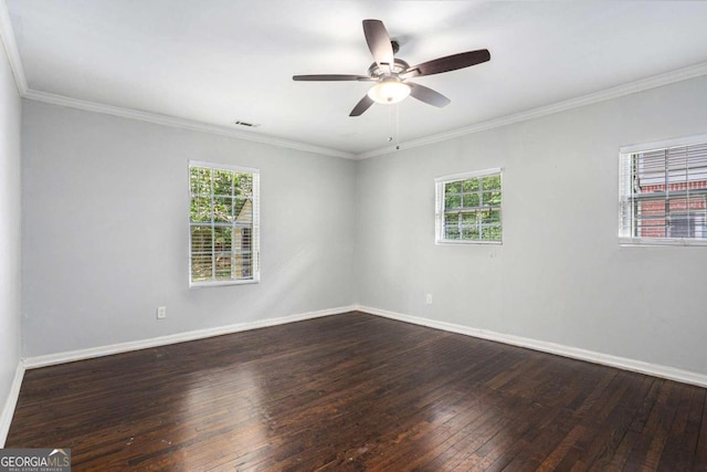 unfurnished room with plenty of natural light, crown molding, and wood-type flooring