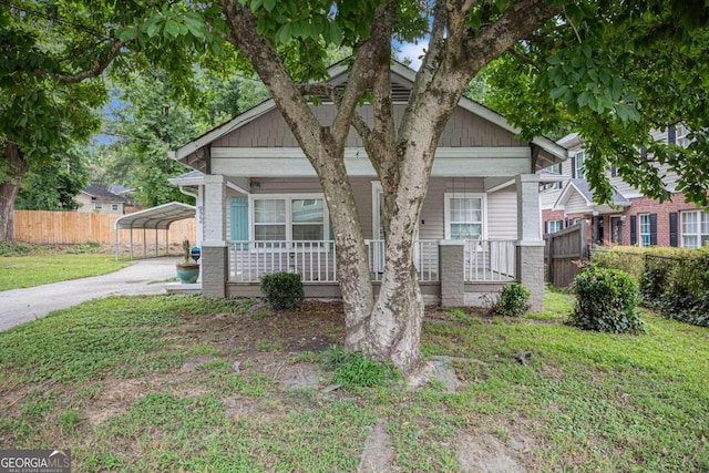 bungalow with a porch and a carport