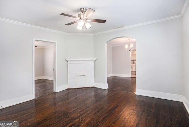 empty room featuring ceiling fan, ornamental molding, and hardwood / wood-style flooring